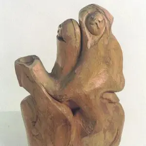 Abstract wooden sculpture with two seated figures.