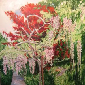 Garden scene with vibrant plants and sculpture.