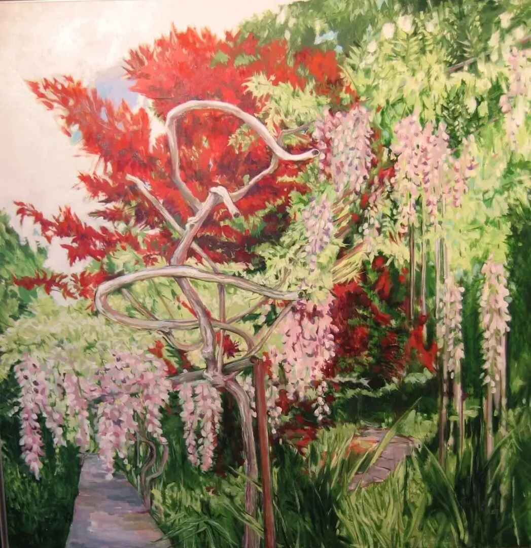 Colorful garden with wisteria and red foliage.