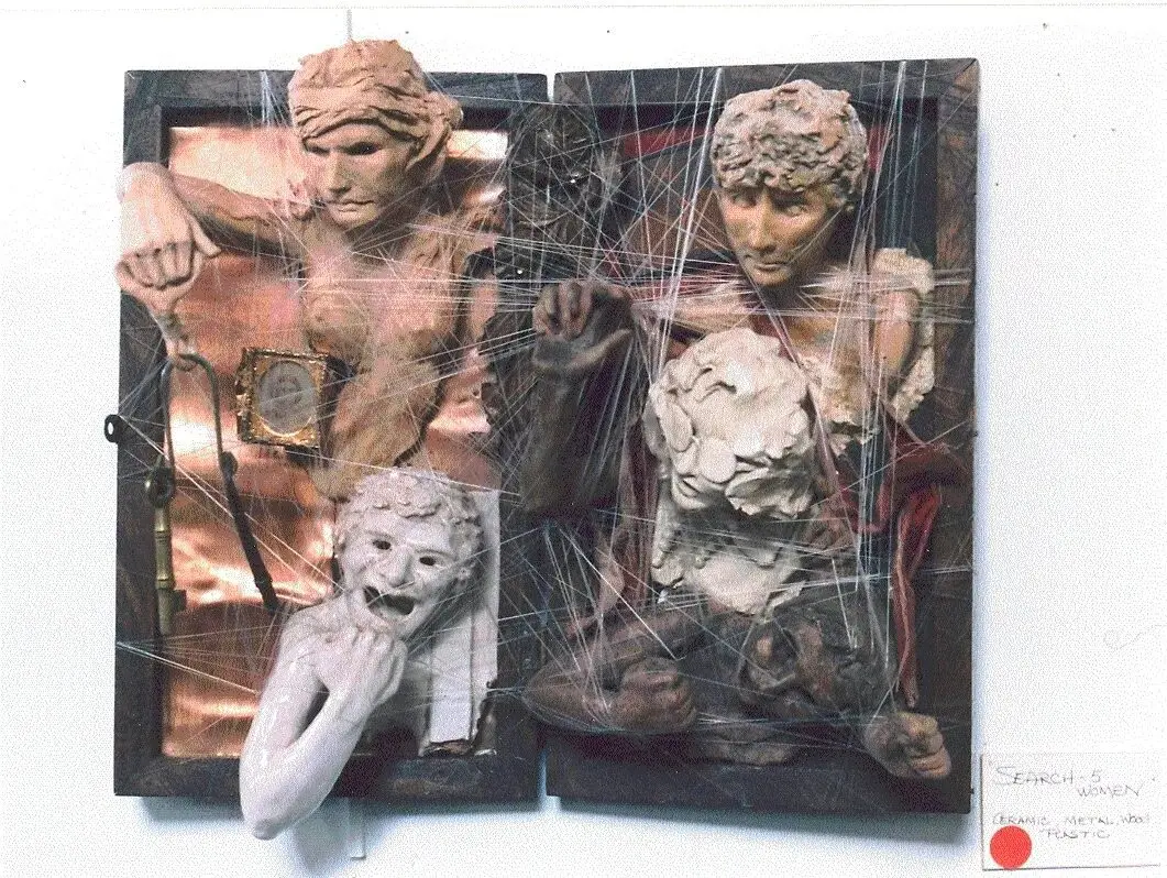 Mixed media sculpture with human and animal figures.