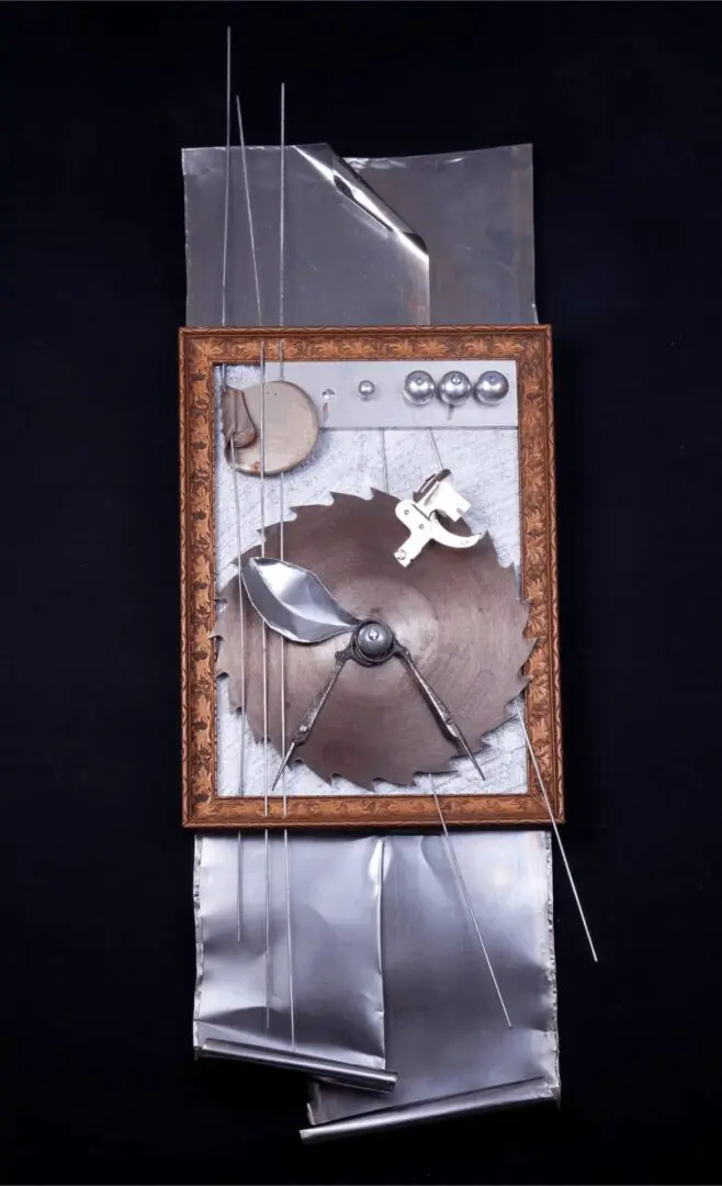 Abstract metal sculpture with circular saw blade.