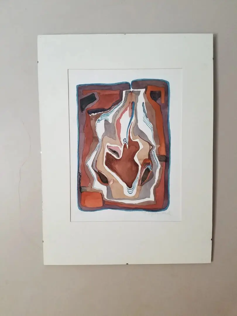 Abstract painting with earthy tones on wall.