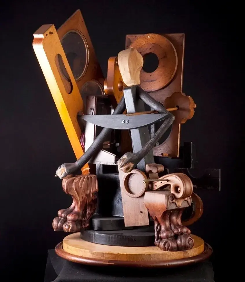 Abstract seated wood figure with circular elements