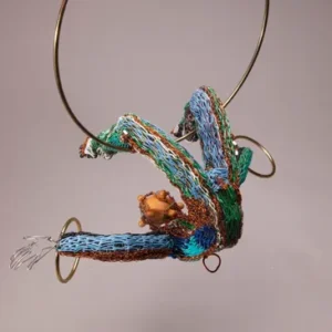 Colorful abstract sculpture with circular metal elements.